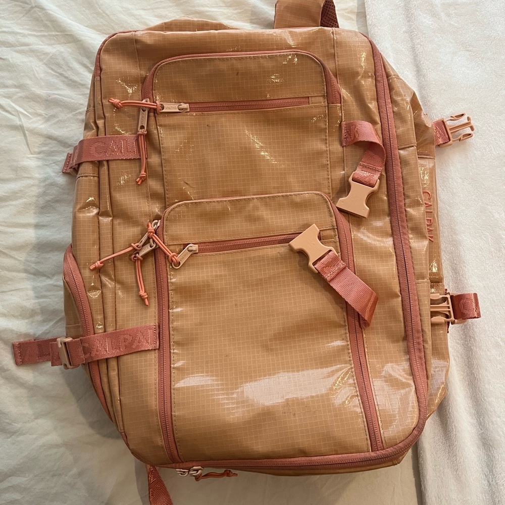 Pink and orange Calpak terra backpack